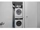 Convenient laundry closet with stacked washer and dryer units at 395 Pharr Ne Rd # 103, Atlanta, GA 30305