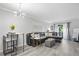 Bright living room featuring contemporary decor, sleek floors, comfortable seating, and a stylish light fixture at 395 Pharr Ne Rd # 103, Atlanta, GA 30305