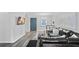 Cozy living room with gray flooring, modern furnishings, and a wall-mounted television for entertainment at 395 Pharr Ne Rd # 103, Atlanta, GA 30305