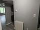 Entryway features gray walls and floors with an adjacent view of the kitchen at 5818 Par Four Ct, Lithonia, GA 30038
