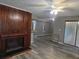 Living room featuring wood-look floors, a fireplace, and sliding doors at 5818 Par Four Ct, Lithonia, GA 30038