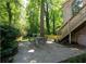 Backyard featuring a patio, seating area, lush greenery and a raised deck, ideal for outdoor enjoyment at 833 Martina Ne Dr, Atlanta, GA 30305