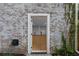 Basement entrance with brick facade and landscaping at 833 Martina Ne Dr, Atlanta, GA 30305