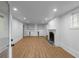Finished basement featuring vinyl flooring, a fireplace, built-in cabinets, and recessed lighting at 833 Martina Ne Dr, Atlanta, GA 30305