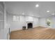 Finished basement featuring vinyl flooring, a fireplace, built-in cabinets, and recessed lighting at 833 Martina Ne Dr, Atlanta, GA 30305