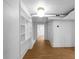 Finished basement features built-in shelving and modern flooring, perfect for additional living space at 833 Martina Ne Dr, Atlanta, GA 30305