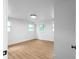 Bright bedroom with hardwood floors and natural light streaming through the multiple windows at 833 Martina Ne Dr, Atlanta, GA 30305
