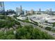 City skyline view from above the treeline showcases the vibrant urban landscape at 833 Martina Ne Dr, Atlanta, GA 30305