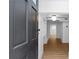 Inviting entryway with hardwood floors, built-in shelving, and contemporary lighting fixtures at 833 Martina Ne Dr, Atlanta, GA 30305