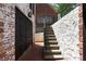 Brick home with a garage and exterior staircase, blending classic charm with functional design at 833 Martina Ne Dr, Atlanta, GA 30305