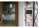 Close-up of a detailed glass front door beside a historical landmark plaque on a vintage brick wall at 833 Martina Ne Dr, Atlanta, GA 30305
