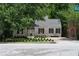 Charming brick home with a well-maintained front yard, lovely landscaping, and a classic roofline at 833 Martina Ne Dr, Atlanta, GA 30305