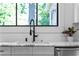 Bright kitchen sink with marble countertops, stainless steel appliances, and a modern faucet at 833 Martina Ne Dr, Atlanta, GA 30305