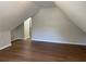 Finished attic showcasing wood-look floors and neutral-colored walls at 219 Maple Creek, Woodstock, GA 30188