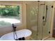 This bathroom features a soaker tub and a glass shower at 219 Maple Creek, Woodstock, GA 30188