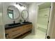 Bathroom with a double sink vanity and a view into the tiled shower and bathtub at 219 Maple Creek, Woodstock, GA 30188
