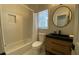 This bathroom features a vanity, neutral paint, and a shower/tub combo at 219 Maple Creek, Woodstock, GA 30188