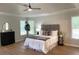 This bedroom offers recessed ceilings, wood floors, and great natural light at 219 Maple Creek, Woodstock, GA 30188