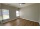 This is an unfurnished bedroom with wood floors and a ceiling fan at 219 Maple Creek, Woodstock, GA 30188