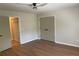 Bedroom featuring wood-look flooring, access to closet space, and neutral wall colors at 219 Maple Creek, Woodstock, GA 30188