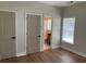This is an unfurnished bedroom with wood floors and neutral paint at 219 Maple Creek, Woodstock, GA 30188