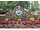 Parkside at Bradshaw Farm entrance sign with stone and beautiful flowers at 219 Maple Creek, Woodstock, GA 30188