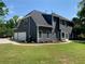 Beautiful two-story home with a well-manicured lawn and a private garage at 219 Maple Creek, Woodstock, GA 30188