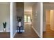 Elegant foyer with wood floors, decorative wall accents, and an inviting entryway into the home at 219 Maple Creek, Woodstock, GA 30188