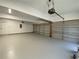 A clean, spacious two car garage with newly painted floor and garage doors at 219 Maple Creek, Woodstock, GA 30188