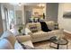 Inviting living room with neutral tones, wood flooring, and plenty of natural light at 219 Maple Creek, Woodstock, GA 30188