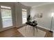 Bright office space boasting a modern desk, wood-look floors, and plenty of natural light at 219 Maple Creek, Woodstock, GA 30188