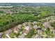 A serene neighborhood with large homes, mature trees, and manicured lawns in a quiet suburban setting at 3341 Anna Ruby Ln, Buford, GA 30519