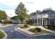 Beautiful brick clubhouse with manicured landscaping and covered entryway, perfect for community gatherings at 3341 Anna Ruby Ln, Buford, GA 30519