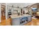 Gourmet kitchen with a large island, custom cabinetry, stone accents, and modern appliances at 3341 Anna Ruby Ln, Buford, GA 30519