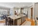 Open-concept kitchen with granite island, stainless steel appliances, and ample cabinet space at 3341 Anna Ruby Ln, Buford, GA 30519