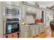 Well-equipped kitchen with custom cabinets, granite countertops, and stainless steel appliances at 3341 Anna Ruby Ln, Buford, GA 30519