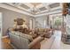 Inviting living room featuring coffered ceilings, a fireplace, hardwood floors, and neutral décor at 3341 Anna Ruby Ln, Buford, GA 30519