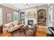 Bright living room with fireplace and built-in shelving, perfect for relaxing and entertaining at 3341 Anna Ruby Ln, Buford, GA 30519