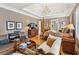Comfortable main bedroom with a four-poster bed, sitting area, and tray ceiling at 3341 Anna Ruby Ln, Buford, GA 30519