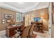 Home office with a large desk, decorative lamps, and a window providing natural light at 3341 Anna Ruby Ln, Buford, GA 30519