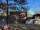 View of home's back exterior, wooden fence, and surrounding backyard landscape at 3709 Charlotte Dr, Rex, GA 30273