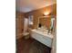 Bathroom featuring tiled floors, a double sink vanity, and bathtub with shower at 3709 Charlotte Dr, Rex, GA 30273