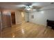 Spacious bedroom featuring hardwood floors, ceiling fan, and multiple closets at 3709 Charlotte Dr, Rex, GA 30273
