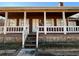 Charming home featuring a covered porch and stone accents at 3709 Charlotte Dr, Rex, GA 30273