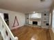 Bright living room featuring hardwood floors and a stone fireplace at 3709 Charlotte Dr, Rex, GA 30273
