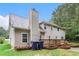 Backyard featuring a chimney, deck, and grass at 4615 Thermal Ct, Douglasville, GA 30135