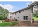 Backyard of home featuring a deck and some trees at 4615 Thermal Ct, Douglasville, GA 30135