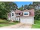 Charming two-story home featuring a two-car garage and well-maintained landscaping at 4615 Thermal Ct, Douglasville, GA 30135