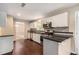 Modern kitchen featuring stainless steel appliances, white cabinets, and dark countertops at 4615 Thermal Ct, Douglasville, GA 30135
