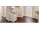 Bright kitchen features hardwood floors, cream-colored walls, and granite countertops at 4615 Thermal Ct, Douglasville, GA 30135